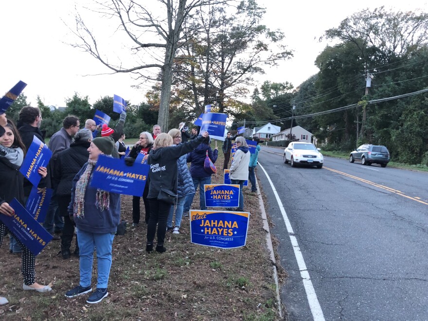 Team Hayes supporters rally for their candidate before a 5th District debate in Danbury, Conn.