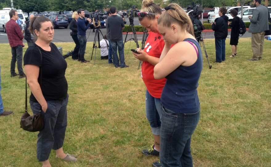 Parents and family members gather at the Cherry Park Safeway in Troutdale, Oregon.