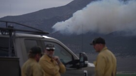 Firefighters gather near the Cottonwood Fire near Junction, Utah, on Friday, June 26, 2026. (AP Photo/Ty ONeil)