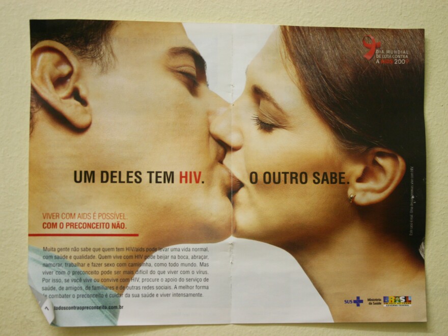 An HIV awareness campaign in a counseling room at the San Francisco de Assisi Hospital in Rio de Janeiro, Brazil. The poster says, "One of them has HIV. The other one knows."