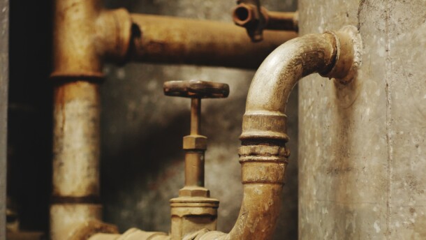 partially corroded lead water pipes with a shut-off valve