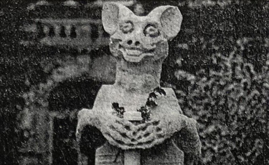 “Olive Goyle” depicted here in Spring 1973 with her original head and a bouquet of dried flowers. This photo was taken around the time of her installation.