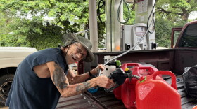 Nāʻālehu resident Joe Steele fills up gas cans at the townʻs gas station on the afternoon of Friday, Sept. 25, 2026, in preparation for Hurricane Nolo.