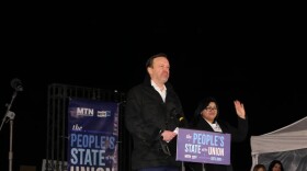 U.S. Sen. Chris Murphy speaks at the "People's State of the Union," a rally to counter President Donald Trump's State of the Union address. His guest Fereshteh Ganjavi of Elena’s Light stands to his right. Credit: Lisa Hagen / CT Mirror