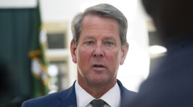 Georgia Gov. Brian Kemp speaks at The Neighborhood Lot on Friday, July 29, 2022, in McDonough, Ga. (AP Photo/Megan Varner )