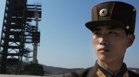 Prior to today's launch, a North Korean soldier stood guard. 