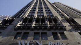 The WGN Radio sign appears on the side of Tribune Tower, Monday, May 1, 2017, in downtown Chicago. TV station operator Tribune Media is at the center of a possible bidding war, following reports that Fox News owner 21st Century Fox and investment firm Blackstone may make a joint takeover bid for the company. (Kiichiro Sato/AP)