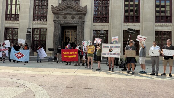 Several local organizations demonstrated outside of City Hall ahead of the hearing. The demonstrators are opposing Flock cameras.