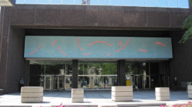 The artwork "Red Neon Circle Fragments on a Blue Wall 1978" on the front of the Walter H. Rice Federal Building and U.S. Courthouse in Dayton.