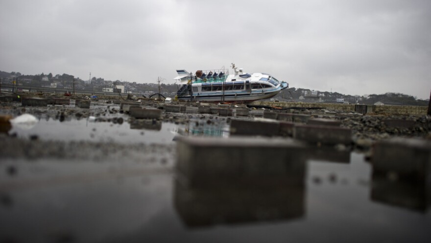 In Japan, the first recorded use of the word "tsunami" occurred well over 1,000 years ago. Tuesday, a boat lay aground after being washed inshore near Sendai.