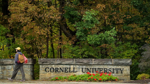 A student walks past a Cornell University sign in Ithaca, N.Y., Monday, Sept. 28, 2026.