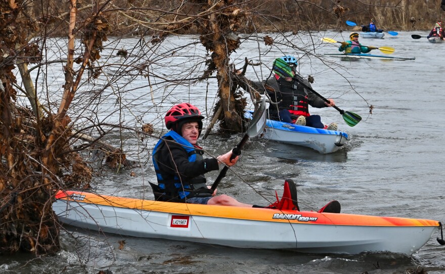 Kayakers paddle around trees in the swollen Lackawanna River during the LRCA's ShiverFest on Saturday, Jan. 13.