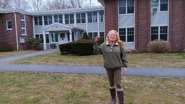 Tammie Docekal with a set of keys for her first apartment after being homeless for two years.