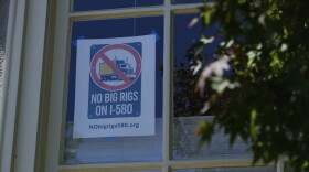 A “NO BIG RIGS ON I-580” poster hangs in the front window of Susan Gallardo’s home in Oakland’s Crocker Highlands neighborhood.