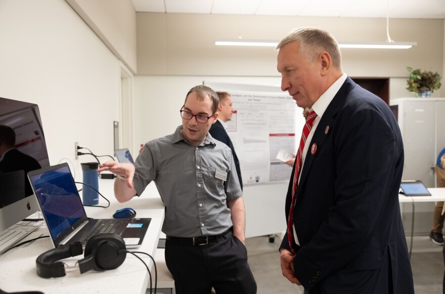 Timashev Family Music building dedication October 23, 2022. Jeremy W. Smith (left) talks with Ratmir Timashev (right).