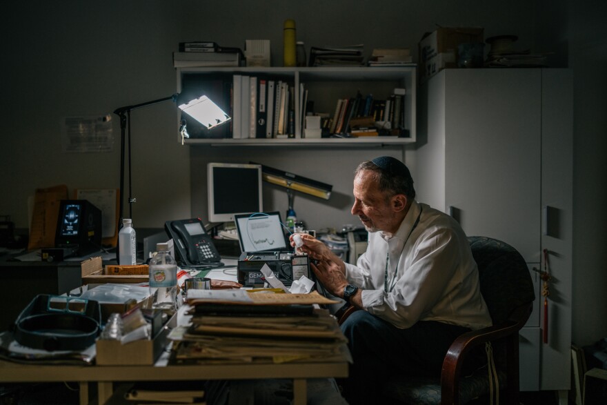 David Weinstein checks the origins of a selection of diamonds at the International Gemological Institute offices in Manhattan.