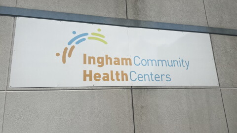 A sign on a building that reads 'Ingham Community Health Centers'
