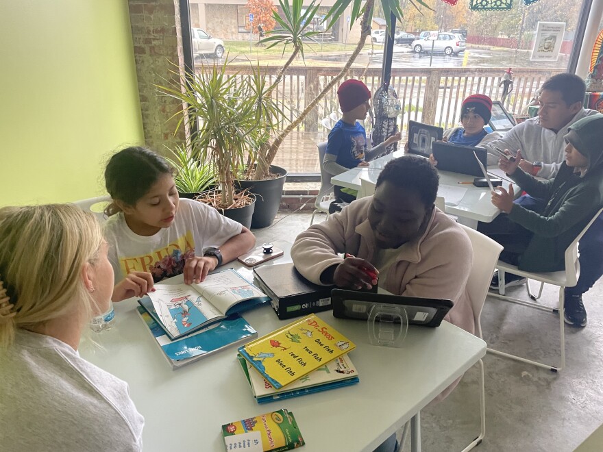 Centro Latino tutors focus on reading lessons after school on Oct. 25, 2022. The after school program is available to kids of all backgrounds K-12. One of the program's goals is to increase high school retention rates as well as increase the rate of Latinos entering higher education.