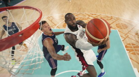 United States' LeBron James (6) shoots during a men's semifinal basketball game against Serbia at Bercy Arena at the 2024 Summer Olympics, Thursday, Aug. 8, 2024, in Paris, France. (AP Photo/Mark J. Terrill,Pool)