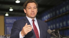 Florida Gov. Ron DeSantis answers questions at a news conference at an emergency management warehouse about the spread of the coronavirus, Friday March 13, 2020 in Tallahassee, Fla. The vast majority of people recover from the new coronavirus. According to the World Health Organization, most people recover in about two to six weeks, depending on the severity of the illness. (AP Photo/Steve Cannon)