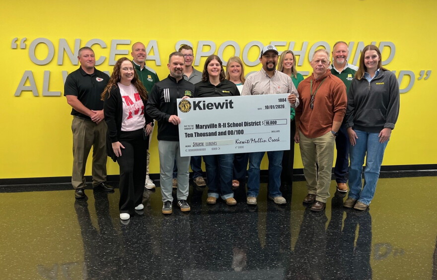 Maryville school district and Kiewit Corporation employees gather for a check presentation at Maryville High School October 1, 2026. Holding the check are (L-R) Maryville school district superintendent Philip Pohren and Heather Bowen and Ryan Mondragon of Kiewit Corporation.