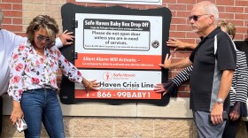 Monica Kelsey (left) joined city officials and residents in Elwood, Indiana, in July to say a blessing over the citys new baby box, a place where newborns can be anonymously surrendered.