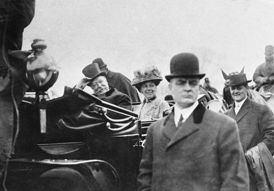 U.S. President William H. Taft and Mrs. Taft sit in a car en route to the White House in this undated file photo from the Library of Congress.