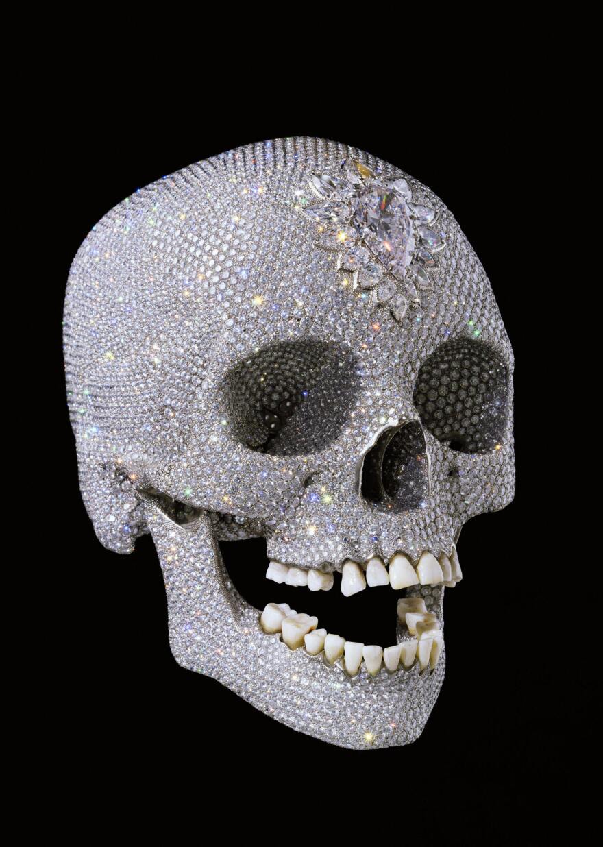 <em>For the Love of God</em>, by British artist Damien Hirst, shows a diamond-encrusted human skull and was unveiled in 2007.
