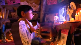 A scene from the Disney-Pixar animated movie <em>Coco</em>, about a young boy, Miguel, who dreams of becoming a musician despite his parents' objections.