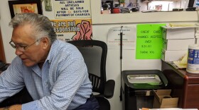 Juan Rios works at his business Chicago Custom Tailor Shop.