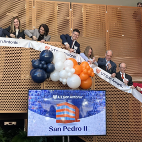 UT San Antonio staff and supporters cut the ribbon for the opening of San Pedro II