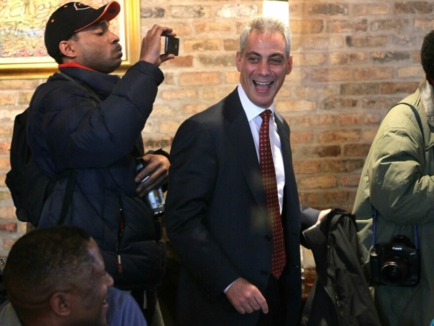 Mayoral candidate Rahm Emanuel leaves Chicago's Home of Chicken and Waffles restaurant following a campaign stop and lunch Monday. He is the front-runner among the six candidates.