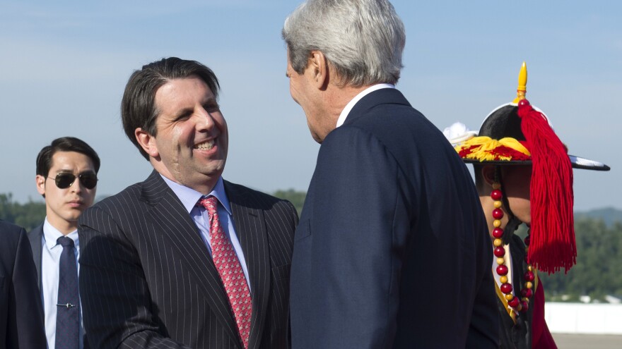 U.S. Ambassador to South Korea Mark Lippert, seen here greeting U.S. Secretary of State John Kerry in May, was attacked during a breakfast function in March.