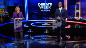Democratic gubernatorial nominee and Michigan Secretary of State Jocelyn Benson, left, joins with with Rep. John James, R-Mich, Republican gubernatorial candidate during a televised debate on Tuesday, Oct. 6, 2026, at WOOD-TV, in Grand Rapids, Mich. (AP Photo/Paul Sancya, Pool)