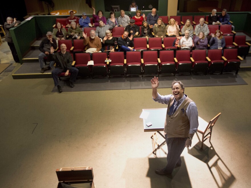 Magician Andrew Pinard waves during his performance at the Hatbox Theater in Concord, N.H. The theater took over the location of a closed clothing store at the Steeplegate Mall.