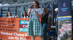 City councilor Stephanie Telles speaks at a rally supporting ranked choice voting before the