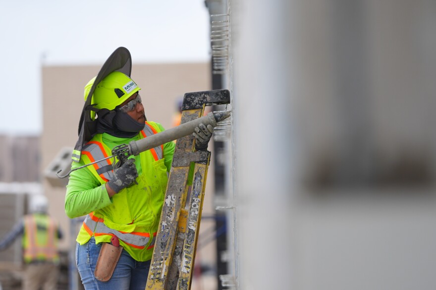 Jennyfer Belehez works construction at Mansfield Stadium chosen as a team base camp training site for the 2026 FIFA World Cup soccer teams, in Mansfield, Texas, Wednesday, March 4, 2026. (AP Photo/LM Otero)