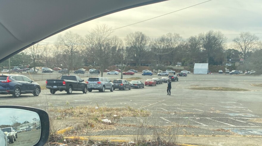  A line of cars is seen at a COVID-19 testing site at the old Eastland Mall in Charlotte on Dec. 24, 2021.