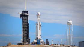 Crews positioned the Falcon Heavy vertically ahead of launch from LC-39A at Kennedy Space Center. Photo: Brendan Byrne / WMFE