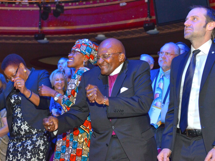 Archbishop Desmond Tutu and his daughter Mpho bust some moves at the 2015 Skoll World Forum.