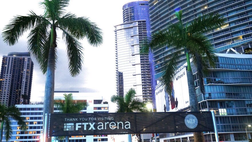 Signage for the FTX Arena, where the Miami Heat basketball team plays, is visible Saturday in Miami. Sam Bankman-Fried received numerous plaudits as the head of cryptocurrency exchange FTX: the savior of crypto, the newest force in Democratic politics and potentially the world's first trillionaire. Now the comments about the 30-year-old aren't so kind.
