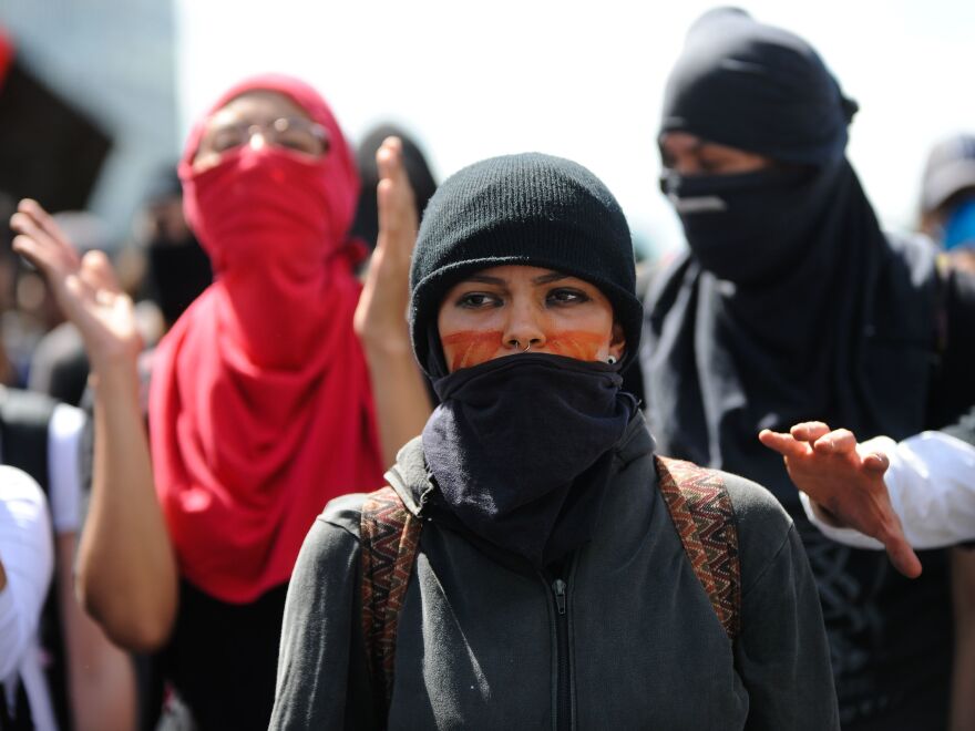 People march on Friday at the Esplanade of the Ministries in Brasilia during a nationwide strike called by unions opposing austerity reforms.