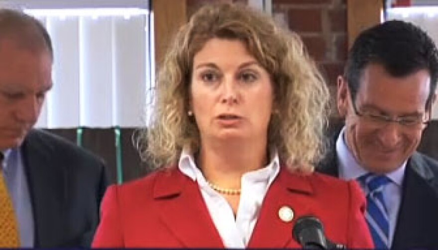 Elin Katz of the Office for Consumer Counsel, alongside Attorney General George Jepsen and Governor Dannel Malloy.