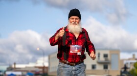 A man dressed as a lumberjack competes in the Lumberjack 5k.