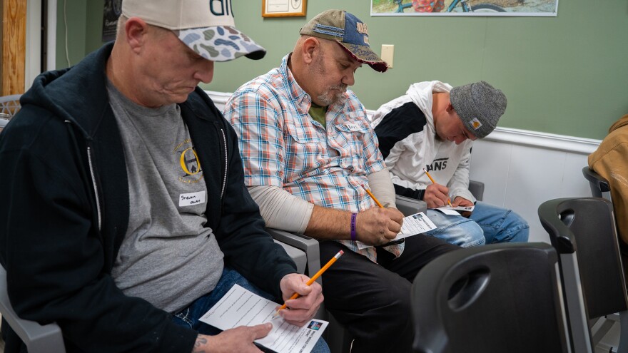 People with lived experience of opioid addiction fill out a survey form at a listening session held by the Gulf States Newsroom at Moore’s Bike Shop on Thursday, January 29, 2026, in Hattiesburg, Mississippi.
