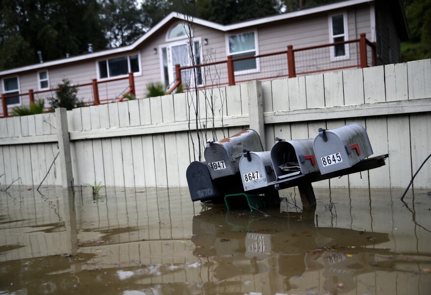 Mailboxes sit underwater in a flooded neighborhood in Forestville, Calif.