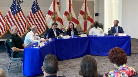 People sitting around a dais