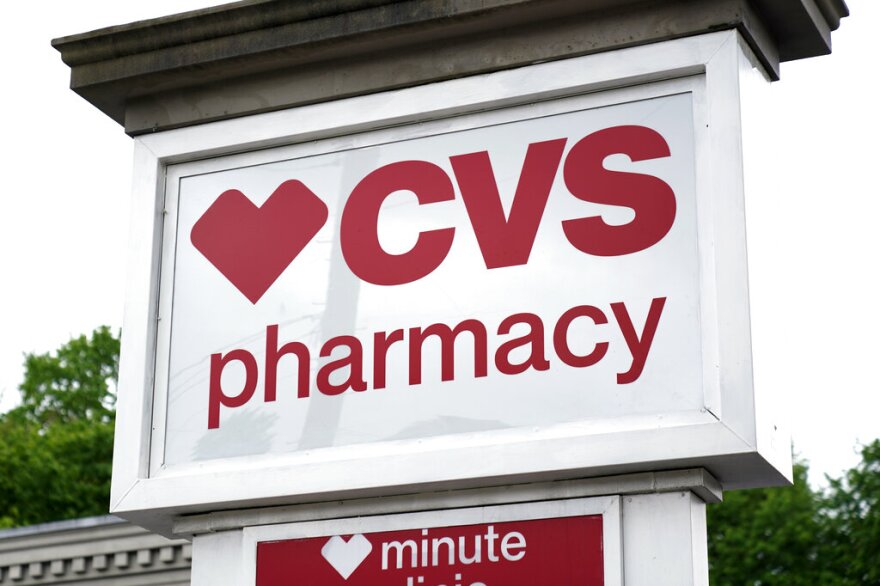 FILE- In this Aug. 7, 2018, file photo a CVS Pharmacy building sign rests on a Jackson, Miss., store. CVS Health reports financial results Wednesday, May 1, 2019. (AP Photo/Rogelio V. Solis, File)