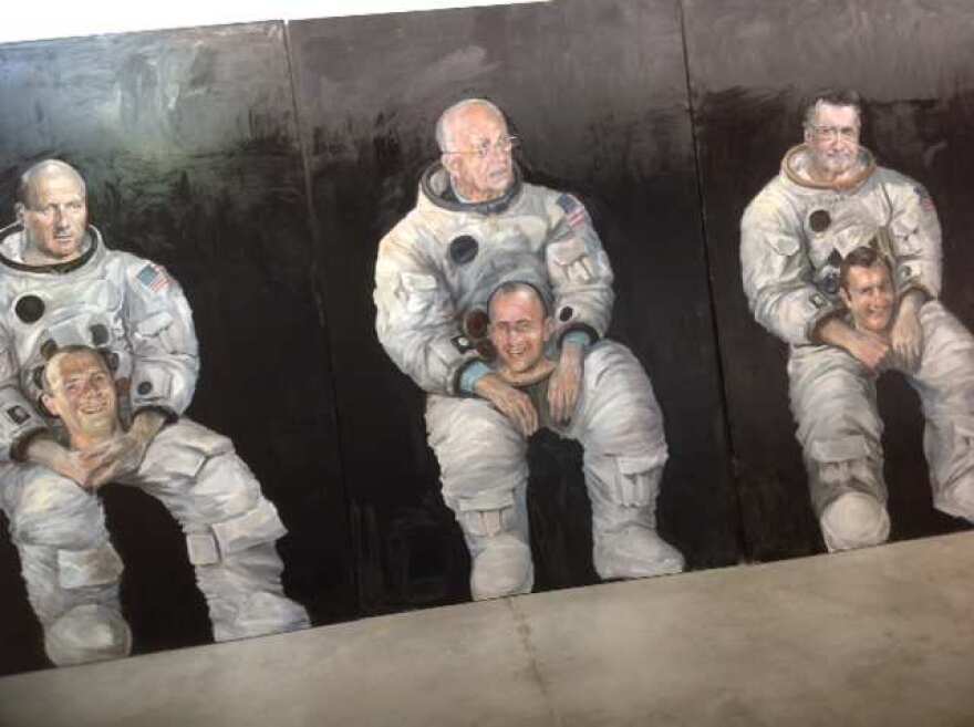 Painting of the Apollo 12 astronauts included in Moon Museum exhibition.