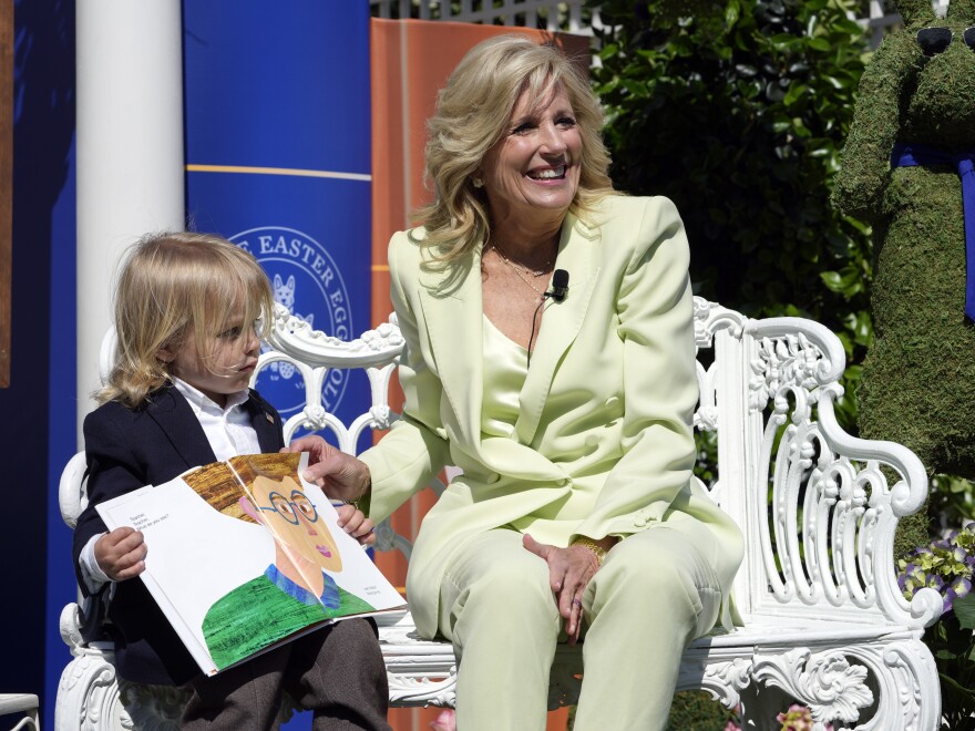 First lady Jill Biden sits with her grandson Beau Biden as she reads <em>Brown Bear, Brown Bear, What Do You See?</em> to children during the annual White House Easter Egg Roll at the White House in Washington.